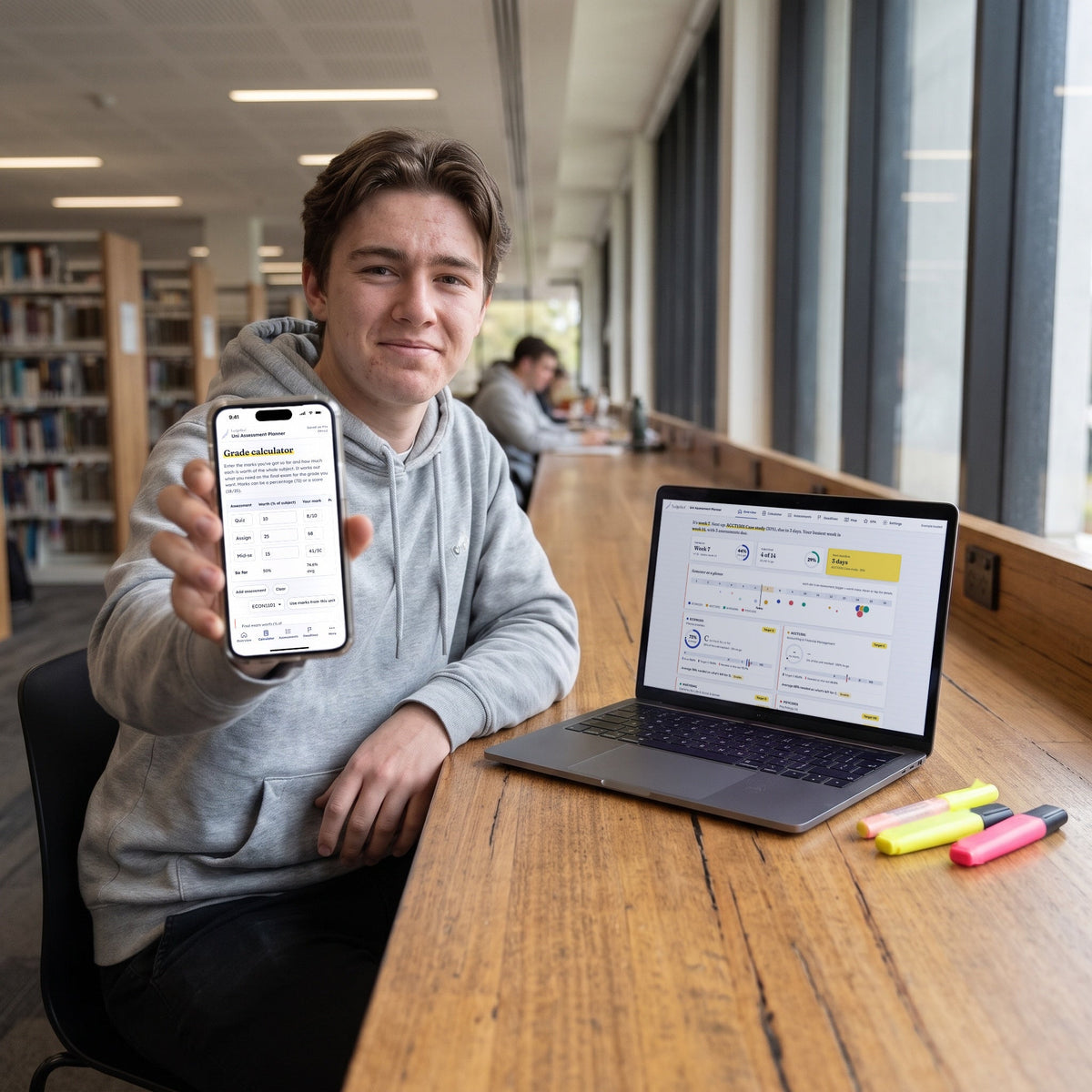A university student holding up the Uni Assessment Planner grade calculator on a phone